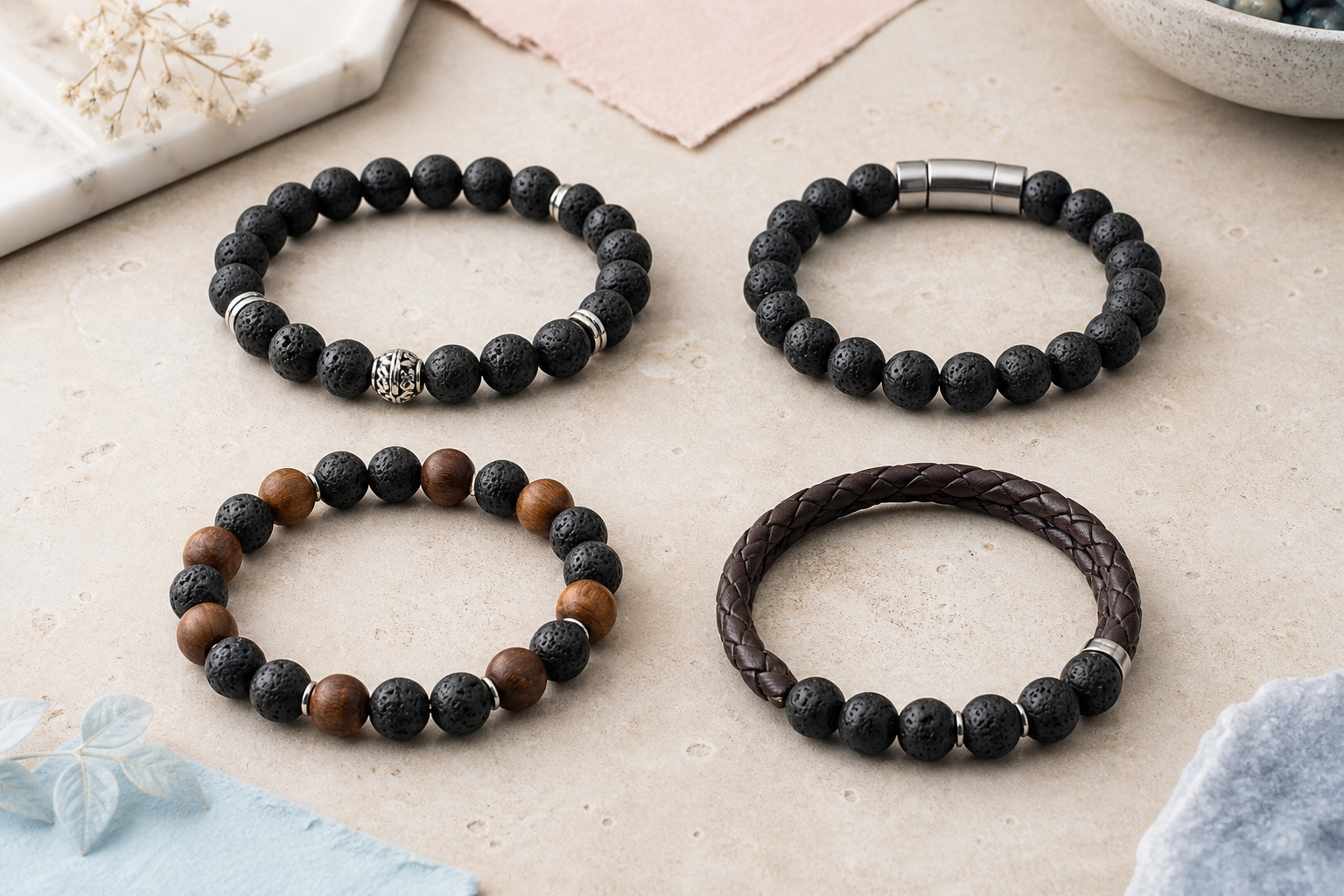 Quatre bracelets associant la pierre de lave à l’argent, à l’acier, au bois et au cuir